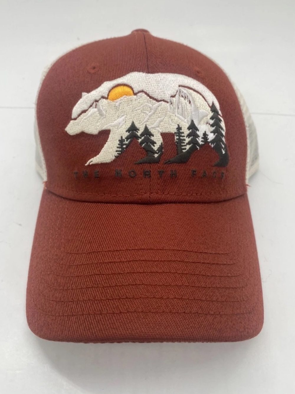 The North Face Rust Trucker Hat with Bear Mountain Embroidery